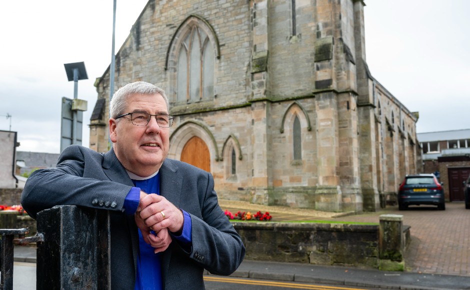 Rt Rev Dr Shaw Patterson outside his church 