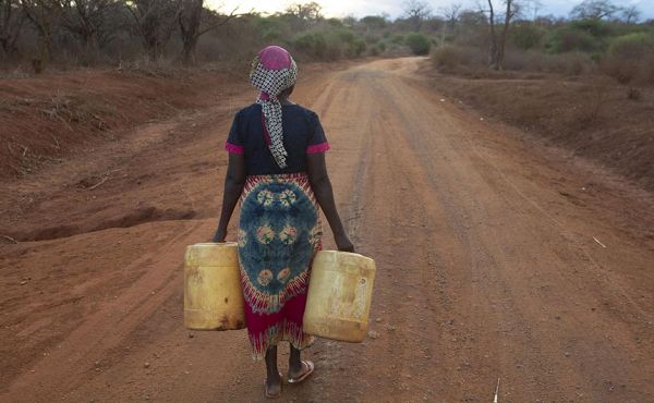 Grandmother Rose Katanu Jonathan, 68, of Kitui, Kenya, walks for six hours most days to collect water. Her nearest dam has dried up. Photo by Adam Finch/Christian Aid.