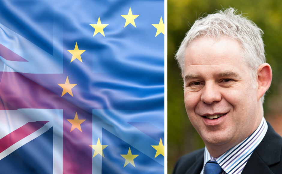 Martin Johnstone, a UK flag and an EU flag
