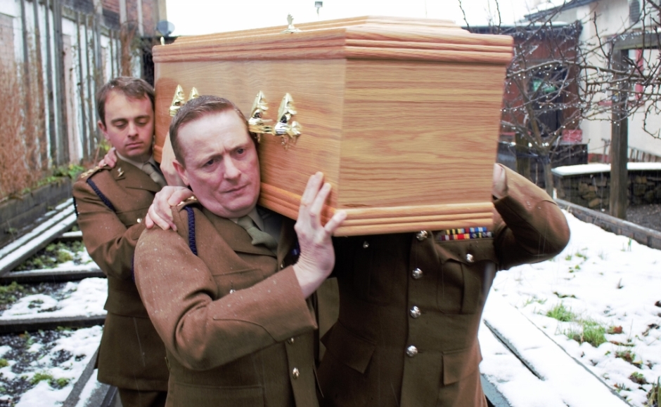 Servicemen from the 32nd Signal Regiment carried Mrs Wallace's coffin to her final resting place.