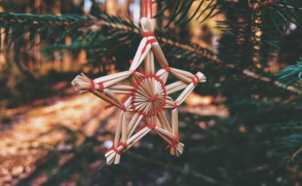Straw star ornament on a Christmas tree