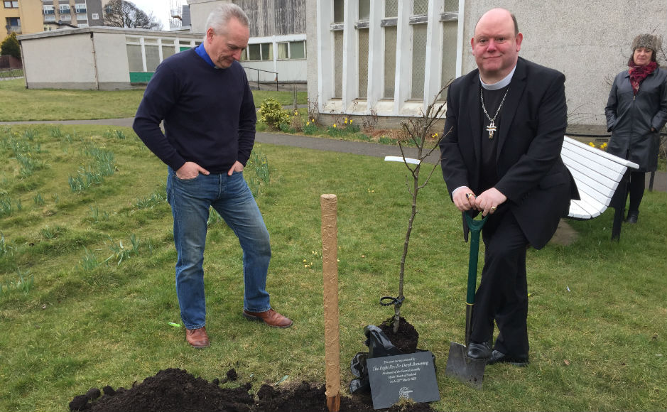 Rev Stephen  Ashley with the Moderator planting a pear tree