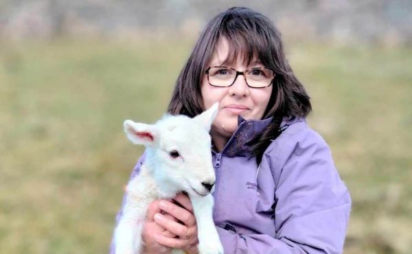 Rev Andrea Boyes with a lamb 