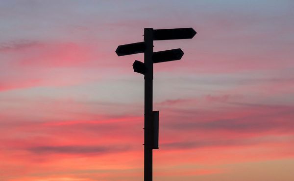 Road sign pointing in different directions