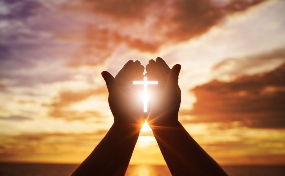 Praying hands with a cross in the middle