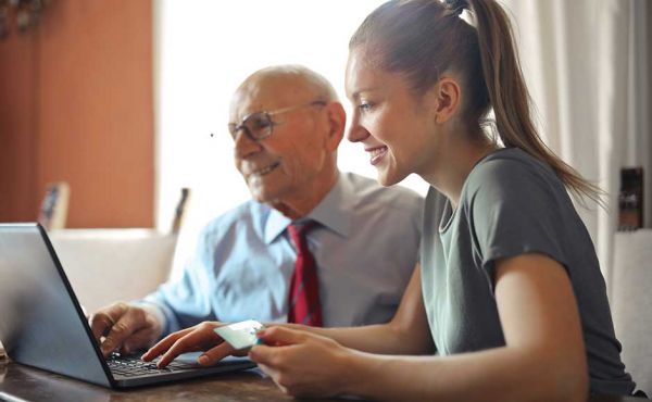 Young woman and man on computer