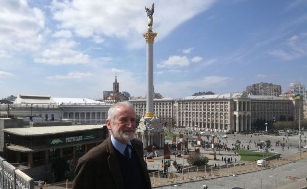 Rev Dr Robert Calvert standing in the centre of Kyiv