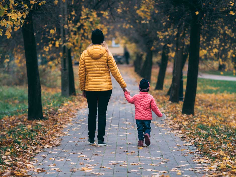 Woman and child walking together