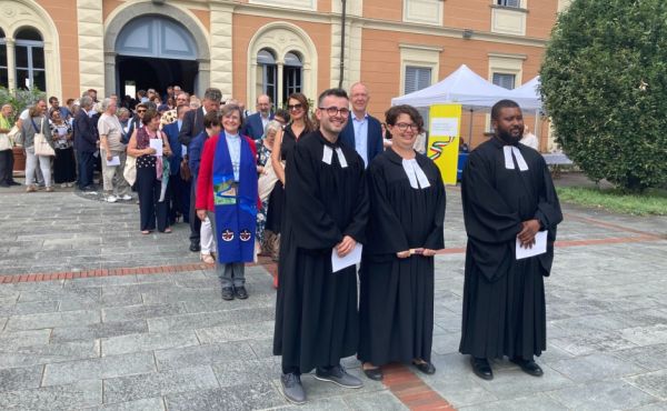 The Casa Valdese (the Waldensian House) in Torre Pellice, Turin. A procession leaving the Synod opening session to go to the church next door to ordain the new pastors, Maliq Meda and Kassim Conteh, who are accompanied in the photo by the minister leading the service, Rev Sophie Langneck. Behind is Rev Tara Curlewis, minister of St Andrew’s, Rome, who was recognised as serving the Waldensian Church in her role as Reformed Ecumenical Officer for the World Communion of Reformed Churches.