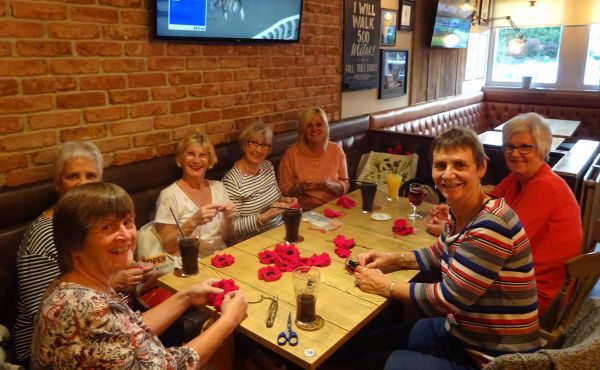 The Crochet Friends group at one of their regular meet-ups preparing for their upcoming poppy display